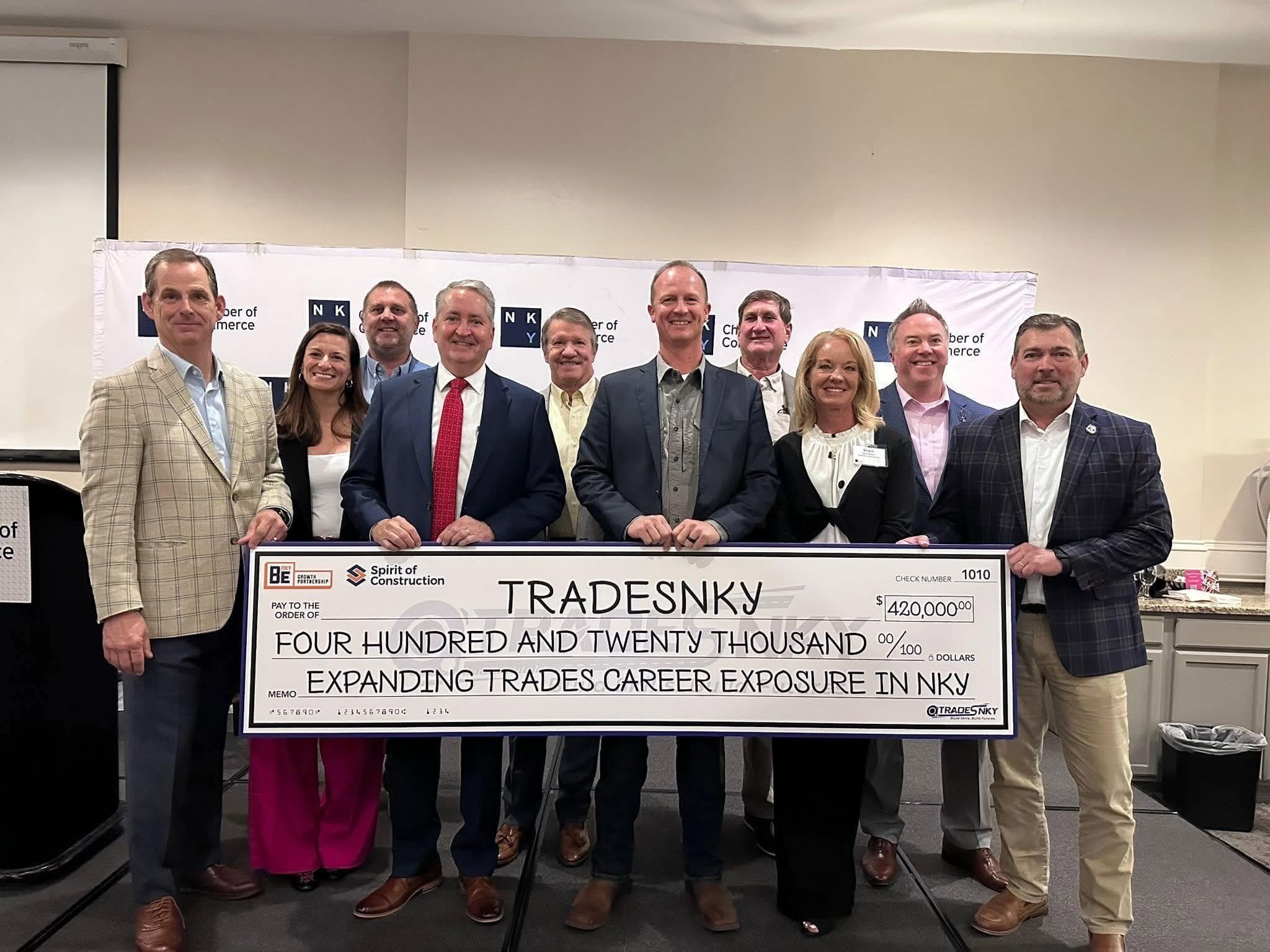 TradesNKY leaders and partners hold a ceremonial $420,000 check from BE NKY and the Spirit of Construction Foundation at the Northern Kentucky Chamber of Commerce