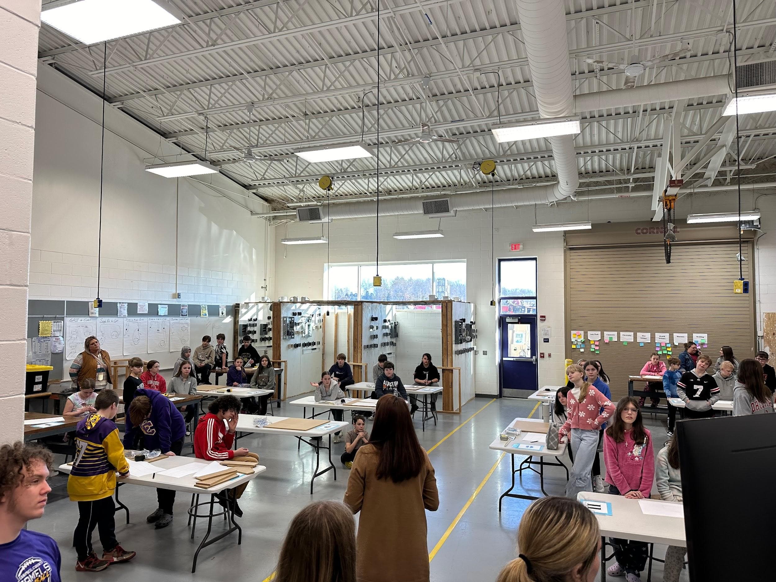 Sixth-grade students work at hands-on stations in Campbell County Middle School’s Introduction to Construction Technology classroom